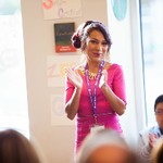 Participant claps at event